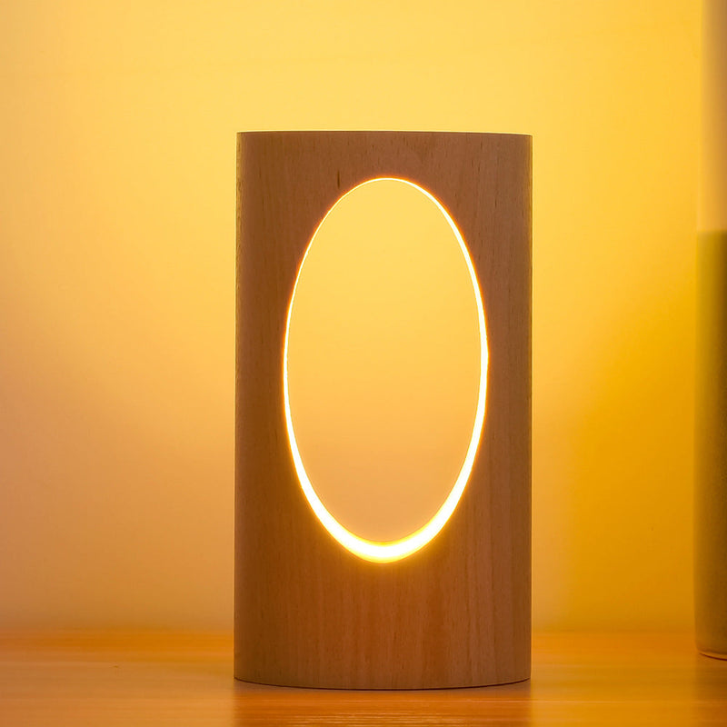 LumiGlow – Elegant cylindrisk bordlampe med oval udskæring til blød belysning