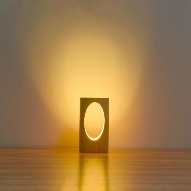 LumiGlow – Elegant cylindrisk bordlampe med oval udskæring til blød belysning