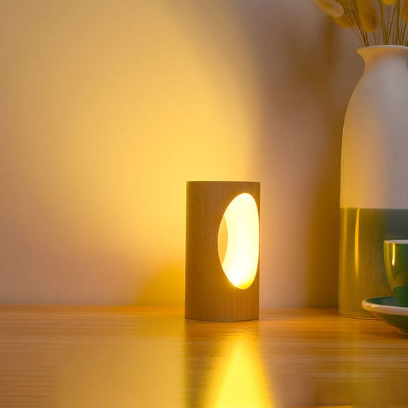 LumiGlow – Elegant cylindrisk bordlampe med oval udskæring til blød belysning