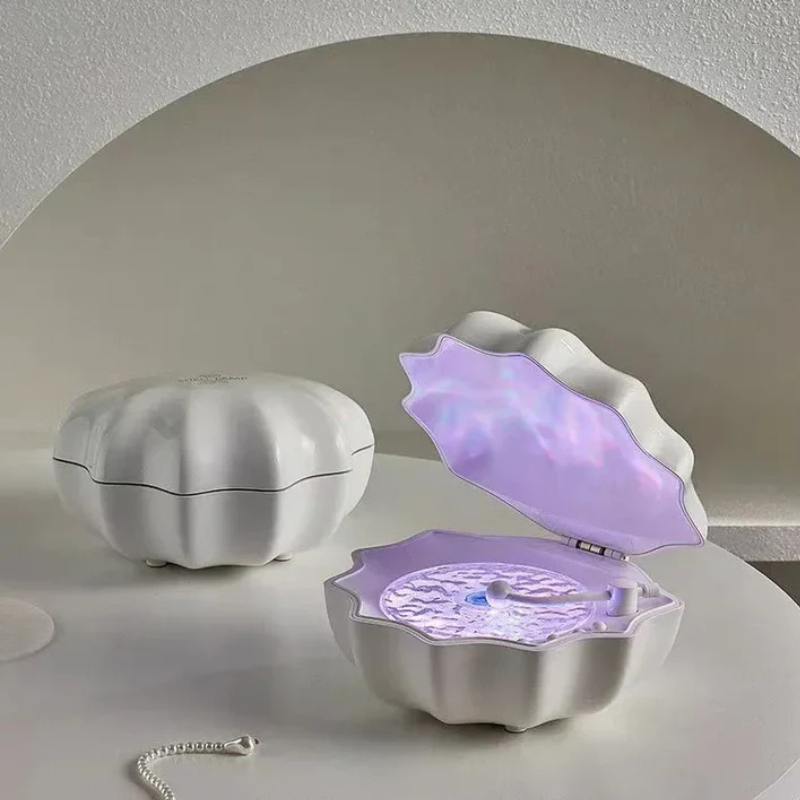 HavenGlow - Muslingeinspireret lampe med Bluetooth-højttaler