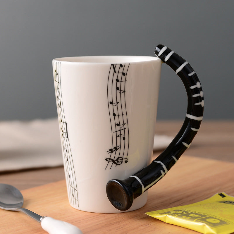 MelodyMug – Legende krus med musiktema med instrumenthåndtag og nodedesign