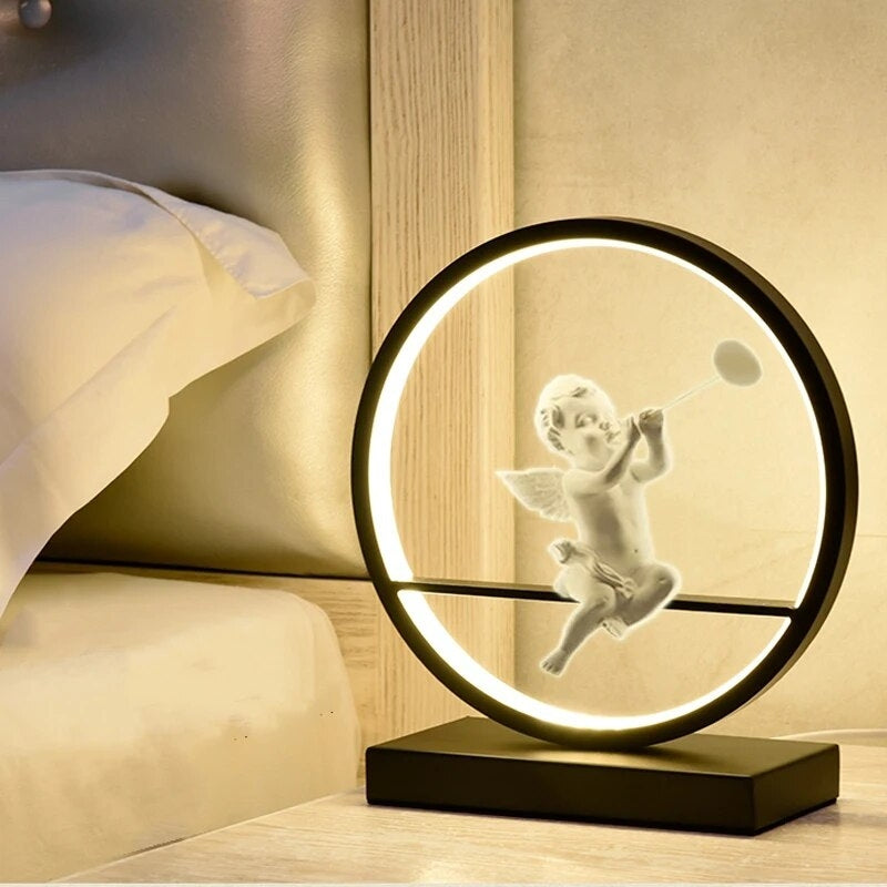 AuraRing - Kunstnerisk LED-bordlampe med englefigur og lysende cirkulær ramme