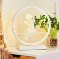 AuraRing - Kunstnerisk LED-bordlampe med englefigur og lysende cirkulær ramme