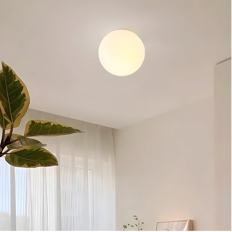AeroBeam - Moderne væglampe med rund, matteret glasskærm og elegant base