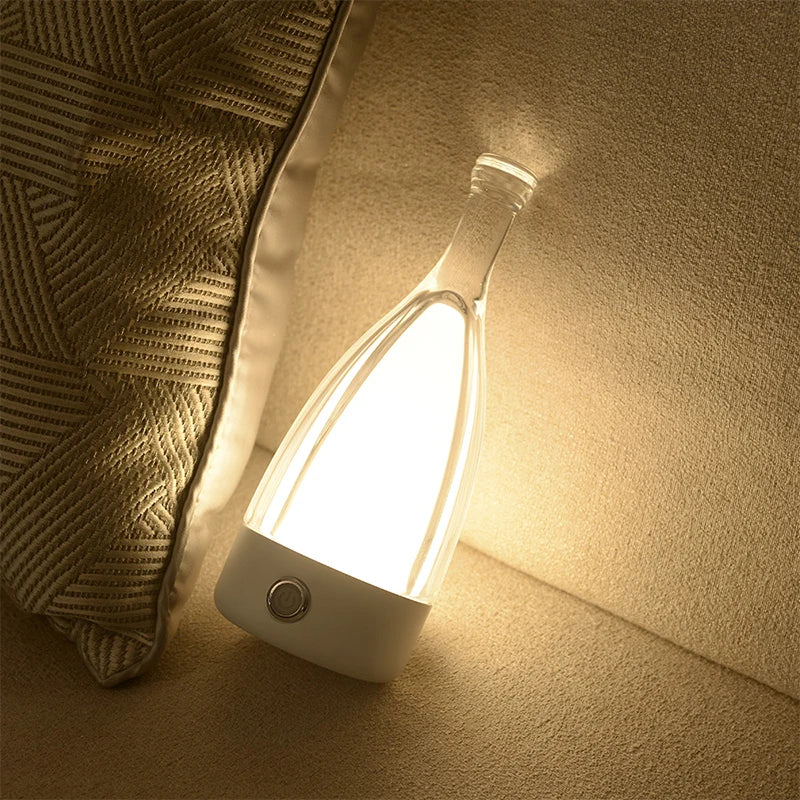 LumoBottle – Moderne bordlampe i form af en flaske med dæmpbart LED-lys til stuer og sociale rum