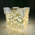BloomAura - LED-gaveæske med lysende silkeblomsterarrangement
