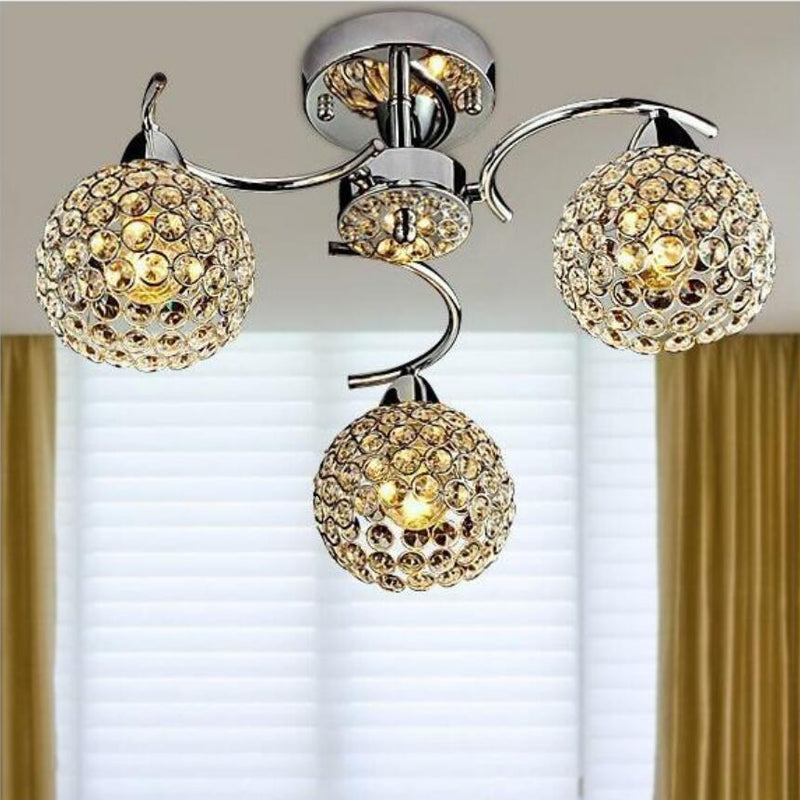 GlitzSphere - Rund loftslampe i krystal med jernramme og elegant funklende design