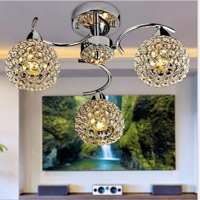 GlitzSphere - Rund loftslampe i krystal med jernramme og elegant funklende design