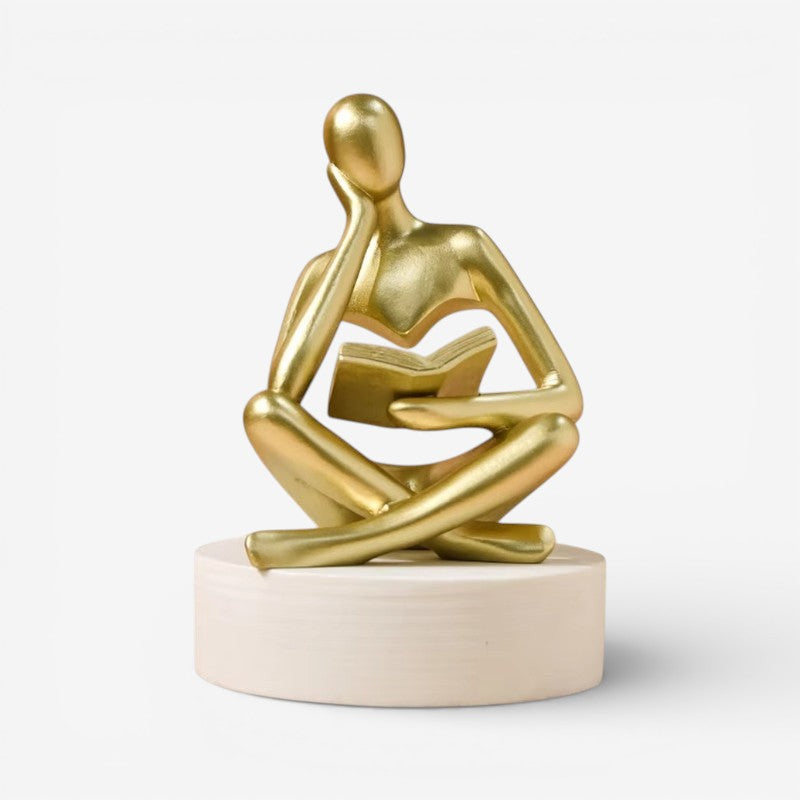StatueAura - Figurstatue af Menneskelig Figur med Bogdesign