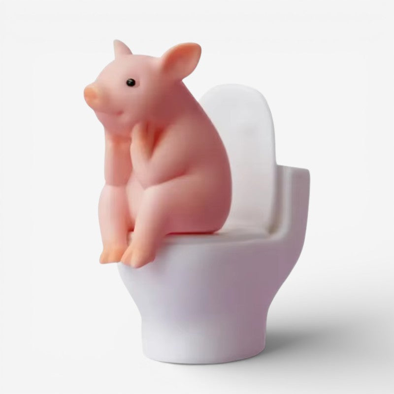 PigSmirk – Dekorativ figur af gris på toilet