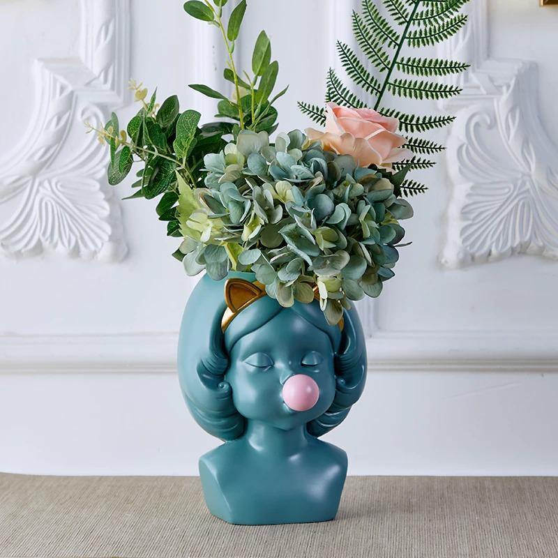 BloomMuse - Kunstnerisk ansigtsformet plantekasse med skulpturelle detaljer